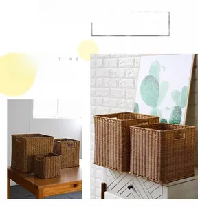 Close-up of durable woven storage baskets with handles in a home interior setting