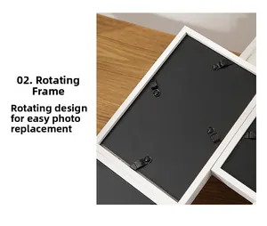 Detail showing rotating clips on white wooden picture frame back for easy photo swaps