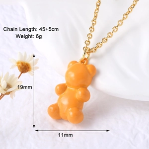 Detail showing the orange gummy bear pendant with size dimensions 19mm by 11mm