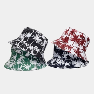 Set of four bucket hats with tropical palm tree patterns in multiple vibrant colors