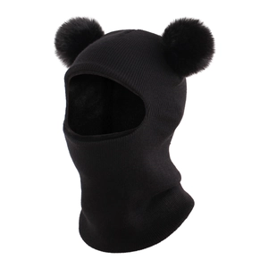 Detail of black knitted baby balaclava featuring cute faux fur pom-pom bear ears