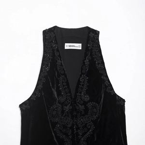 Women's black velvet vest featuring heavy embroidery and delicate beadwork detailing