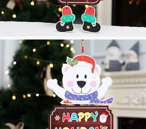 Close-up of polar bear Christmas door hanger with Happy Holidays sign in a festive setting