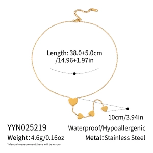 Detail view of golden heart necklace with size specs and stainless steel material info