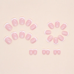 Pink French tips short press-on nails with 24 pieces set on minimalist light background