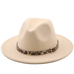 Detail of beige fedora hat featuring a leopard print band and gold metal buckle