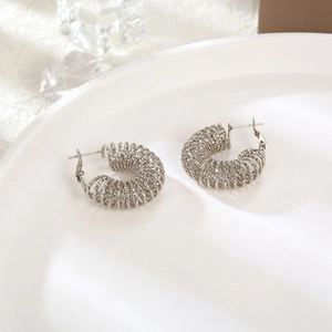 Retro titanium steel hollow spring hoop earrings in silver for women jewelry