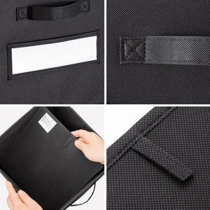 Detail of black non-woven storage box with reinforced handles and clear label window