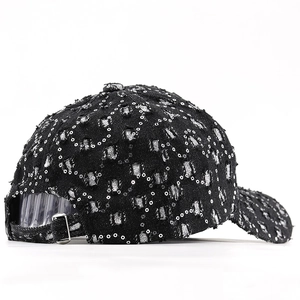 Detailed back view of vintage distressed denim baseball cap with silver sequins and metal buckle