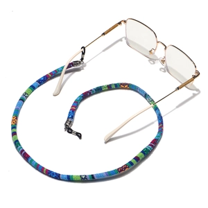 Ethnic bohemian braided eyewear strap with anti-slip silicone loops shown with glasses