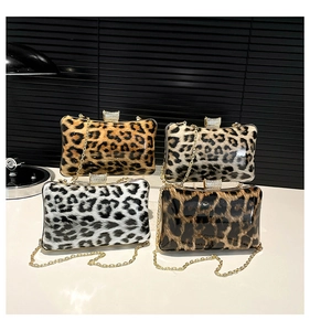 Detail showing various leopard print evening clutches with sparkling diamond buckles and chains