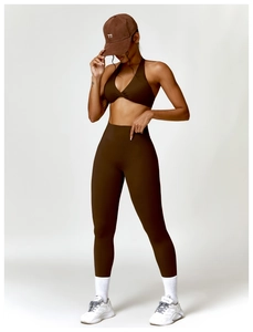 Detailed view of women's brown sports bra and high-waist leggings yoga set