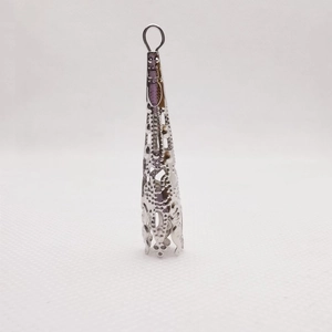 Close-up of silver filigree metal flower bead cap spacer for DIY jewelry making
