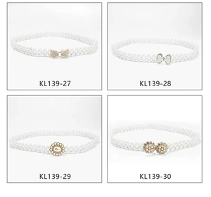 Detail showing four styles of pearl waist belts with decorative metal buckles