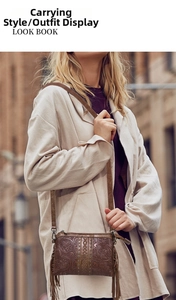 Detail of bohemian brown leather crossbody bag with floral embossing and long tassels