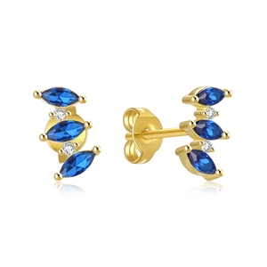 Detail of gold-plated silver earrings with marquise blue zircon and round crystal stones
