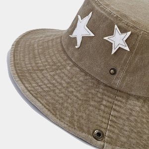 Khaki washed vintage bucket hat with white star patches and metal eyelets for hiking
