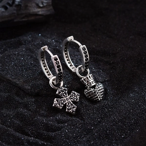 Hip hop silver earrings with black zircon cross and crowned heart charms on dark sand