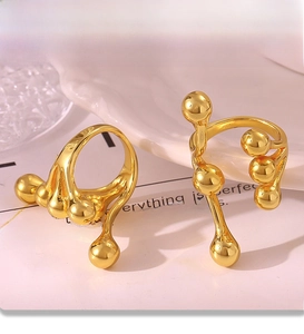 Detail of liquid metal sphere ring with electroplated PVD finish on ceramic plate