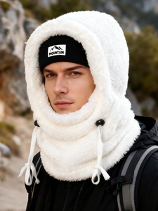 Outdoor close-up of white fleece Balaclava hood with mountain tag knit hat