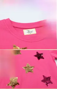 Detail of sequin star embroidery on fuchsia cotton knit T-shirt for young girls