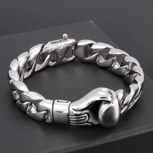 Detailed view of polished 316L stainless steel boxing glove pendant on a cuban chain