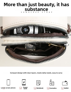 Internal view of the multi-layer mini shoulder bag showing storage for phone and power bank