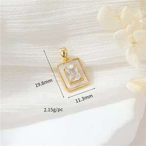 Detail of vintage gold zircon and shell pendant showing size 19.8mm by 11.3mm