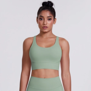 Detailed texture of sage green high-stretch sports bra and high-waist leggings set