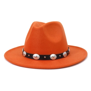 Close-up of orange wool fedora hat with black leather band and silver metallic buckle