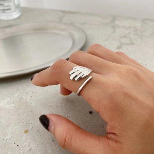 Minimalist S925 sterling silver shell texture open ring shown on hand with a sleek finish