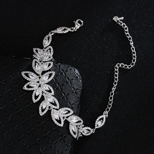 Close-up of silver bridal bracelet with marquise-cut cubic zirconia in a leaf pattern