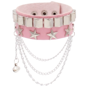 Detail of pink PU leather punk bracelet with silver studs, stars, chains and a bell