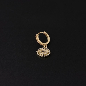 Macro shot of gold-plated evil eye earring with micro-pave cubic zirconia crystals