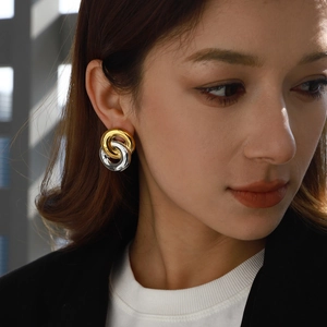 Two-tone intertwined titanium steel hoop earrings in gold and silver finish for women