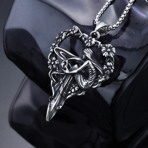 Vintage heart shaped angel relief pendant in stainless steel with elegant flower patterns