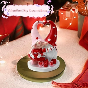 Detailed view of two Valentine's Day gnomes with love heart and pink rose base decor