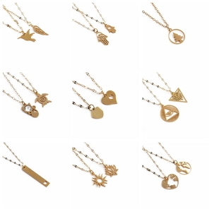 Collection of golden stainless steel necklaces with various nature-themed charms
