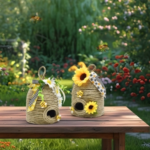 Detail of handmade woven beehive pendants with sunflowers, daisies and cute bees decor