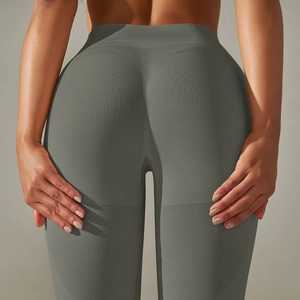 Close-up of grey high-waist seamless yoga pants featuring scrunch butt and ribbed waistband