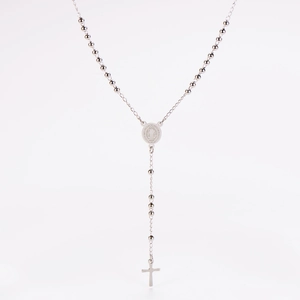 Detailed view of a silver rosary necklace with oval medallion and crucifix pendant