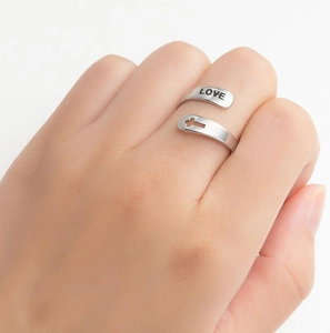 Vintage silver stainless steel open ring featuring Love engraving and a cross design