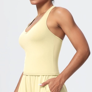 Side view of pale yellow ribbed yoga set showing V-back sports bra and drawstring shorts
