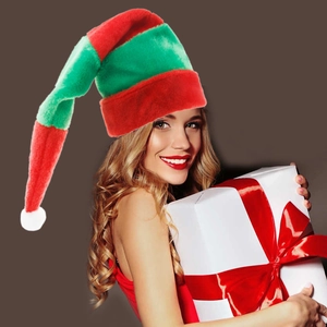 Long red and green striped plush Christmas elf hat worn by a model holding a gift box