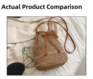 Size comparison of large woven straw bucket bag next to a mobile phone and blazer