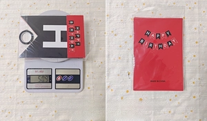 Detailed packaging of black and red Happy Birthday banner set weighing 50.9 grams
