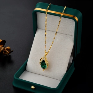 Elegant gold titanium steel necklace with green teardrop zircon pendant in a premium box