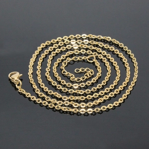 Classic golden stainless steel O-chain necklace with lobster clasp on grey background