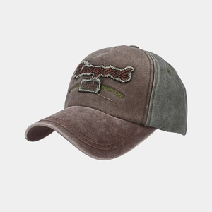 Detailed macro view of distressed cotton fabric and vintage New York embroidery on cap