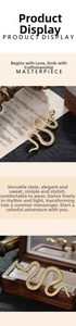 Detailed view of vintage gold snake brooch featuring intricate scale textures and S-shape